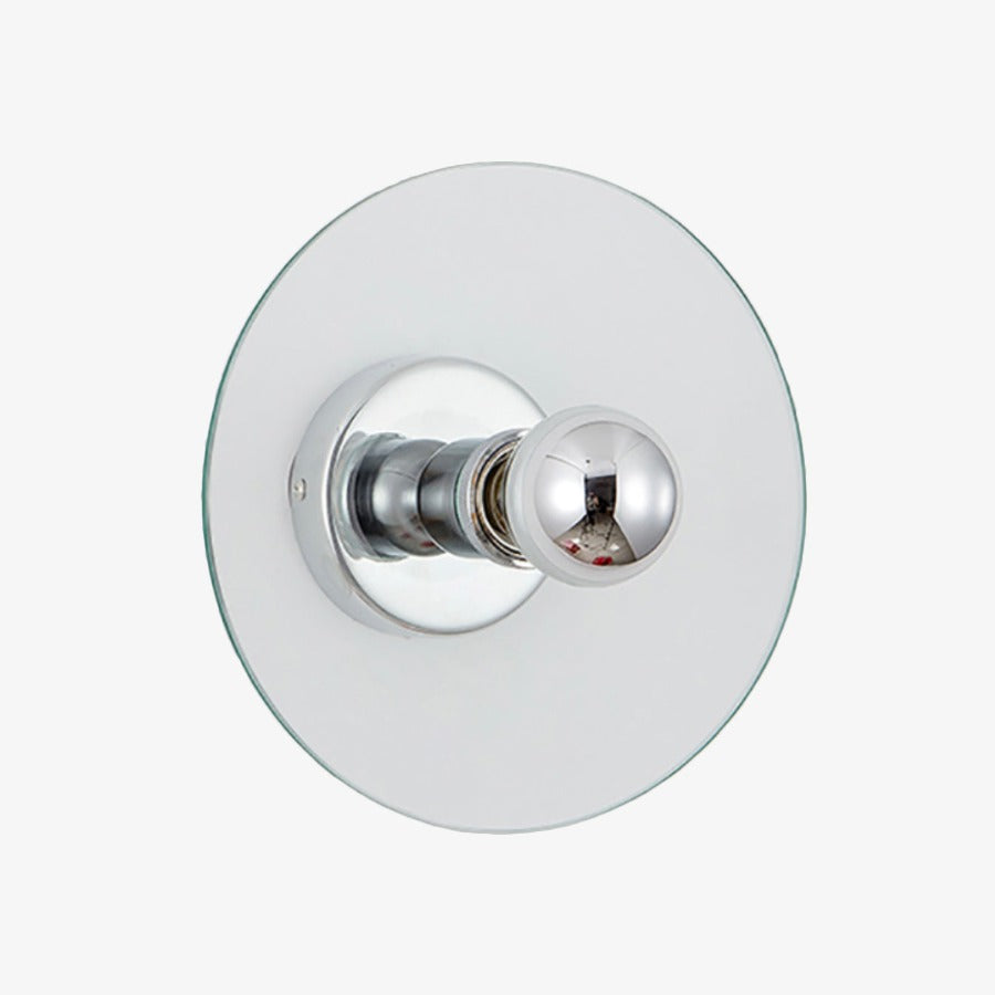 Wall sconces on each side of a bathroom mirror