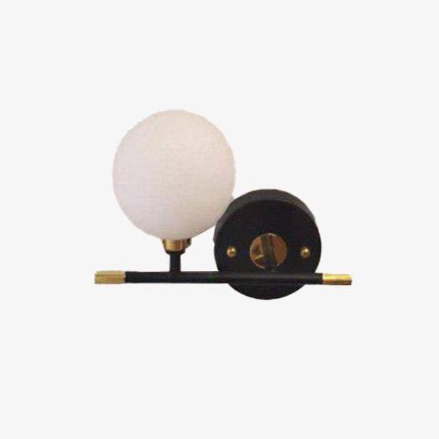 Gold wall light with glass globe