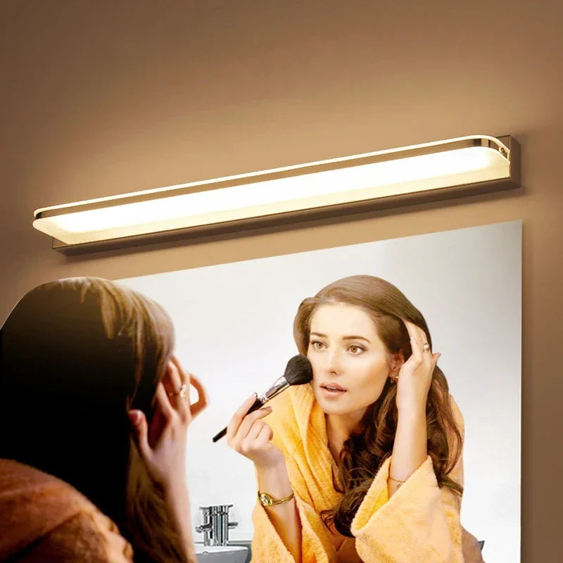 Steel mirror light above a sink