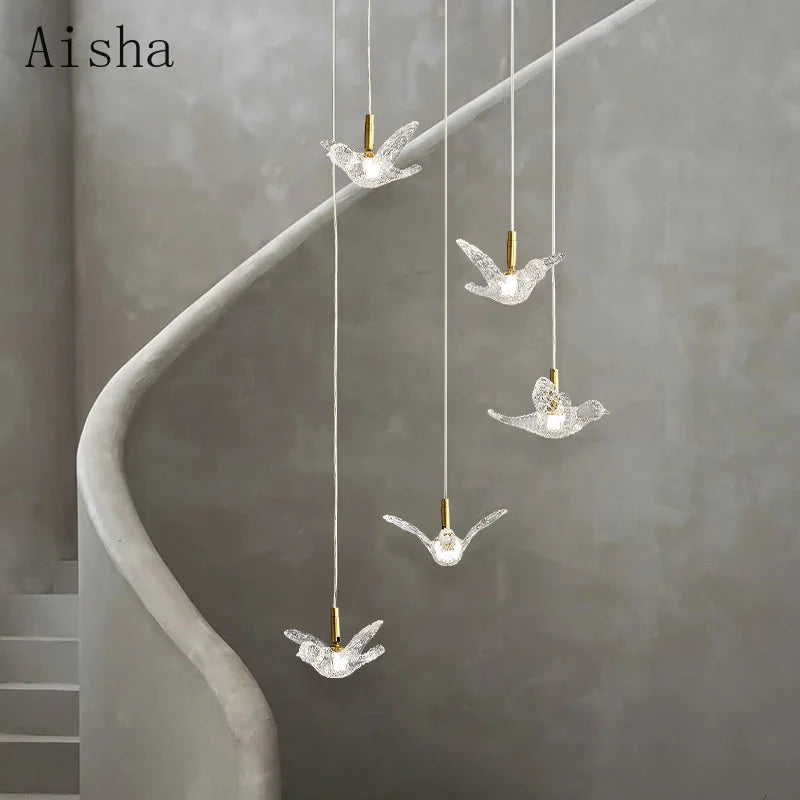 Bird pendants over a dining table