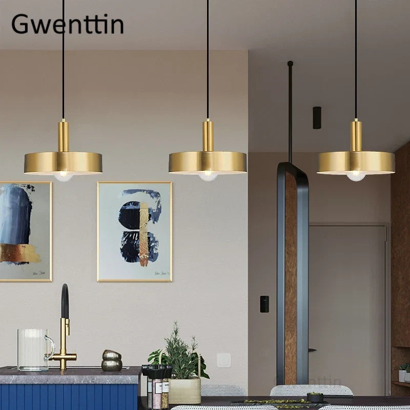 Gold pendant over a kitchen bar