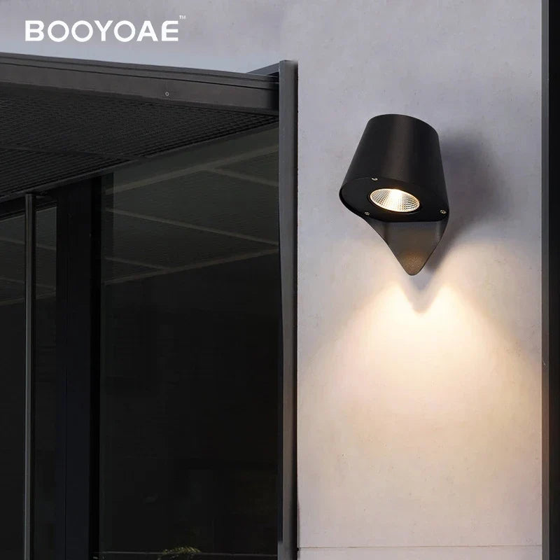 Outdoor wall light by porch stairs