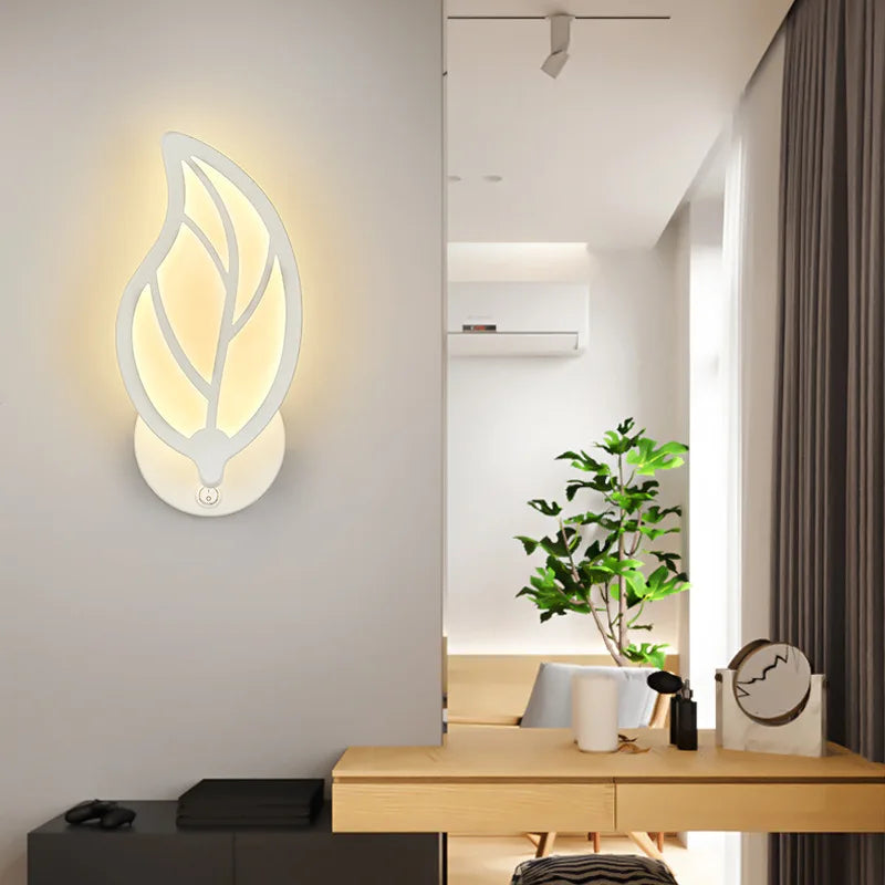 White LED wall light beside a bed