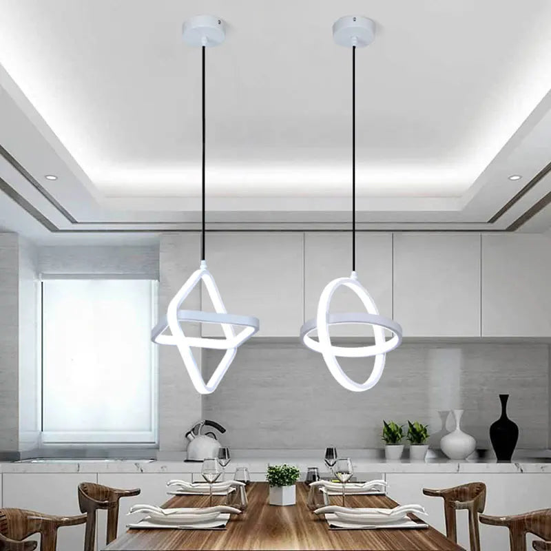 Round LED pendant beside a bed
