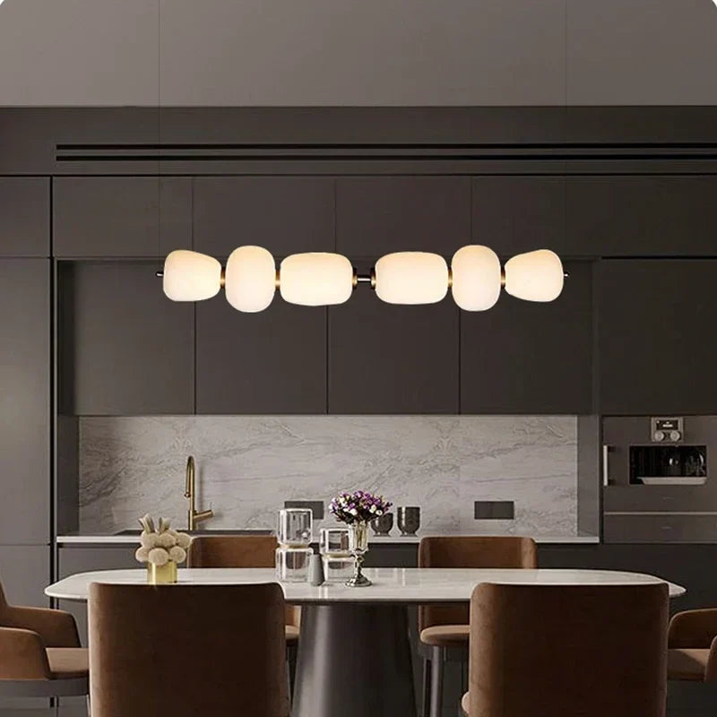 White milk glass pendant over a table
