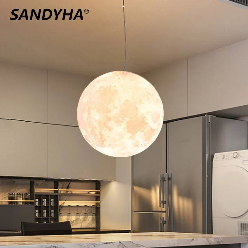 Moon pendant over a dining table