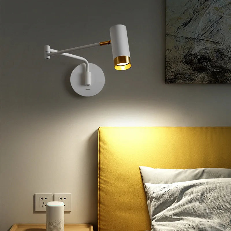 Swing arm wall light by a bed