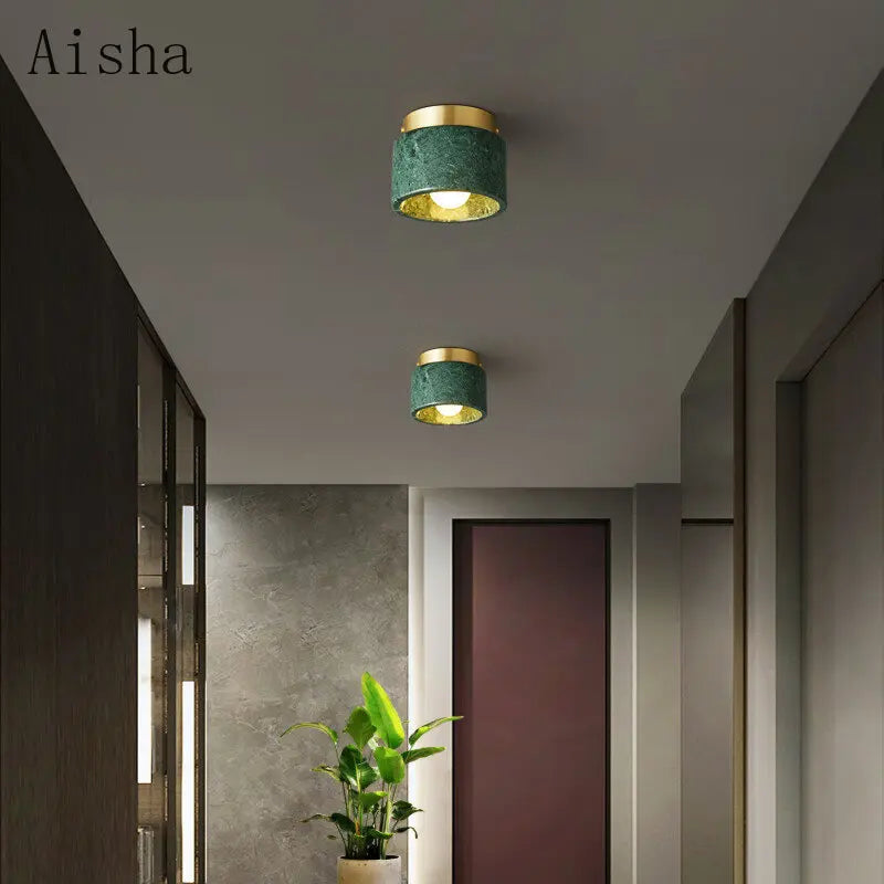 Green marble pendant over a kitchen island