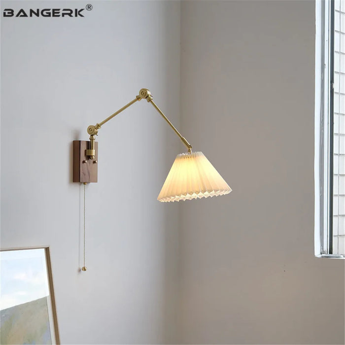 Ceramic brass swing arm wall light