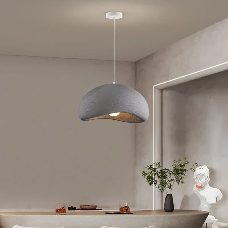 White resin pendant over a dining table