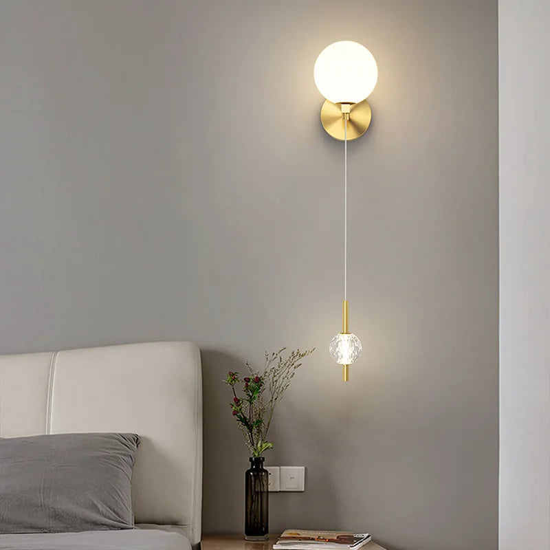Gold three-shade sconce in a living room