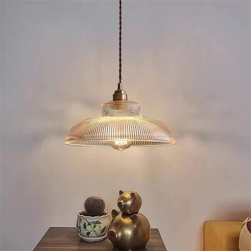 Walnut and glass pendant over a counter
