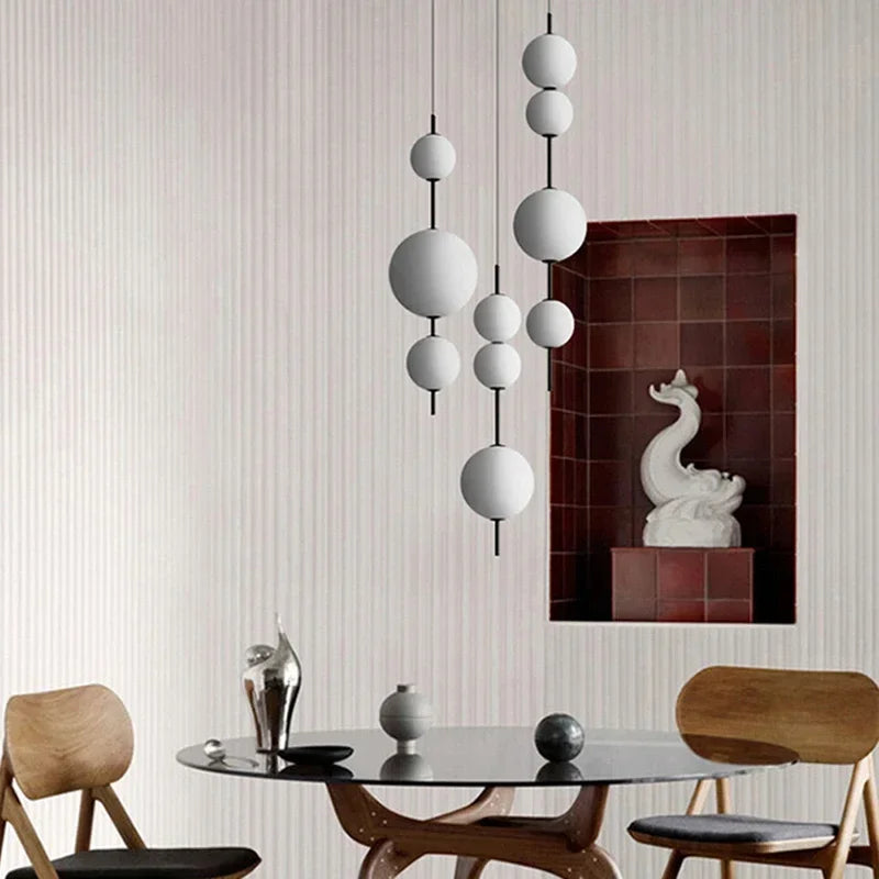 White glass pendant over a kitchen table