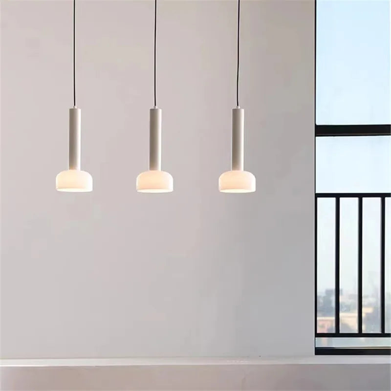 Yellow pendant over a kitchen table
