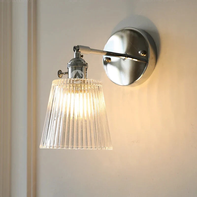 Adjustable arm sconce