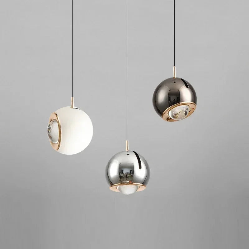 Blue adjustable pendant over a desk
