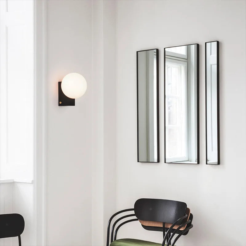 Chrome sconce in a bathroom