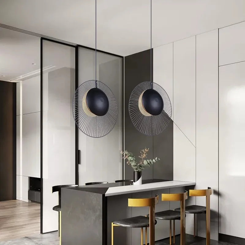 Black pendant over a dining table