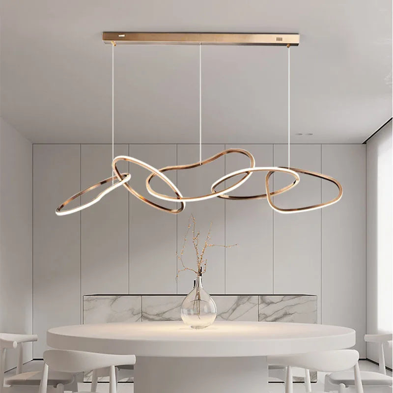 Rose gold pendant over a dining table
