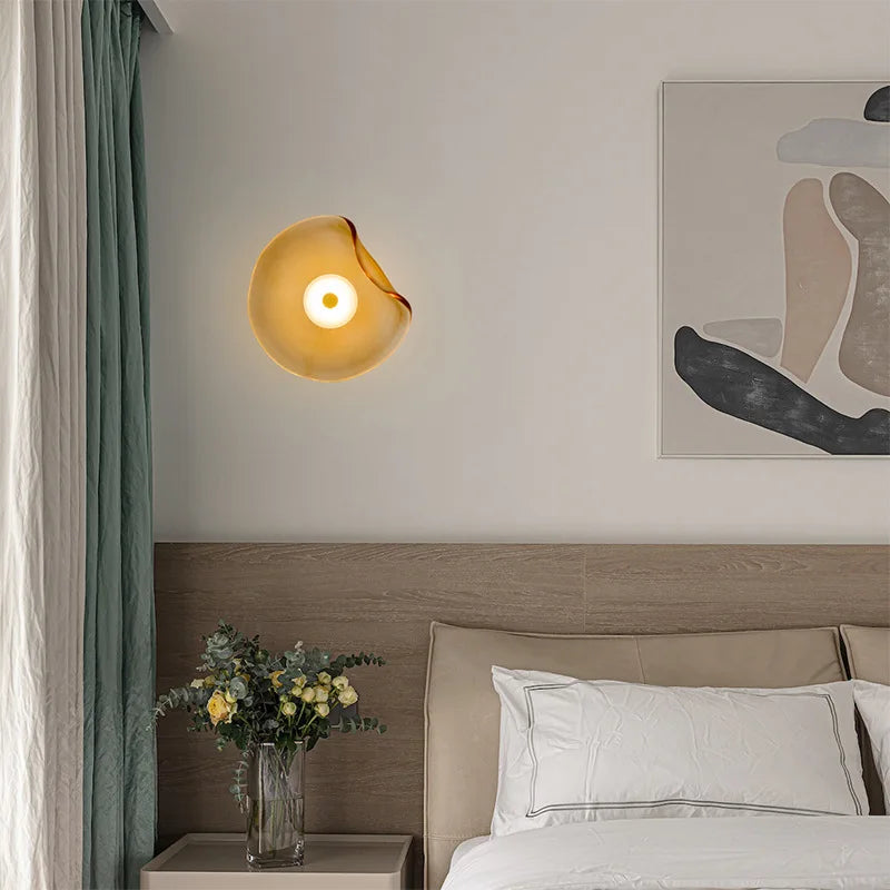 Blue glass wall light in a bedroom