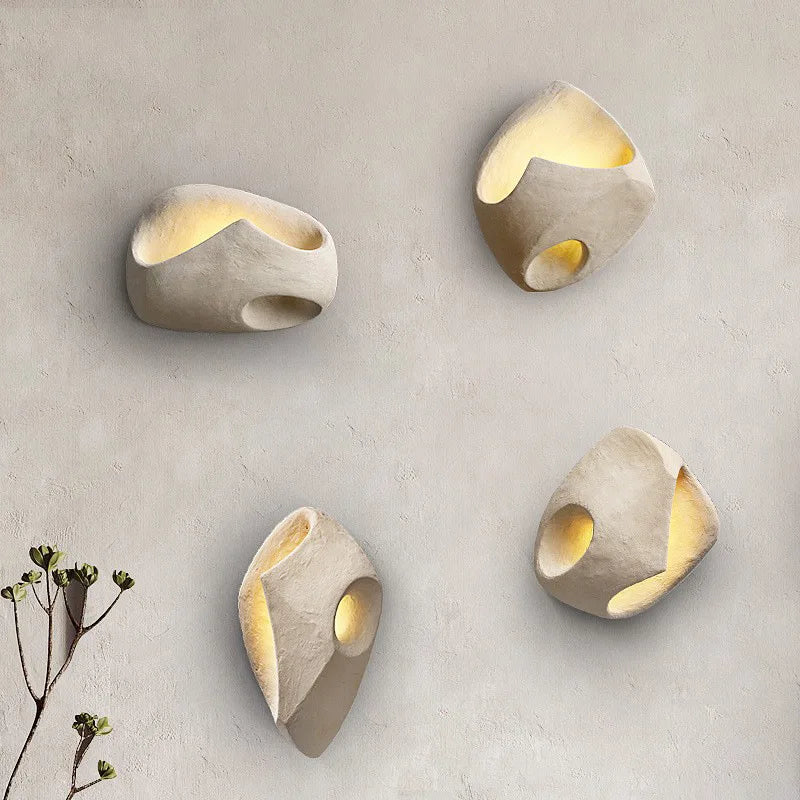 Plaster sconce in a minimalist hallway