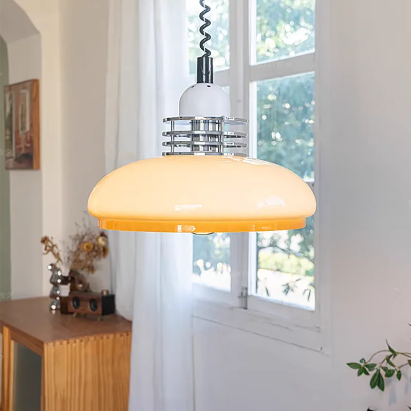 Beige glass pendant over a kitchen table