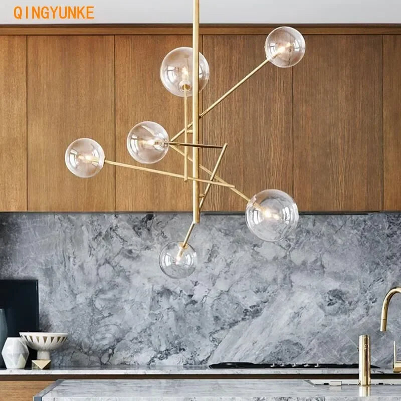Gold glass chandelier over a dining table