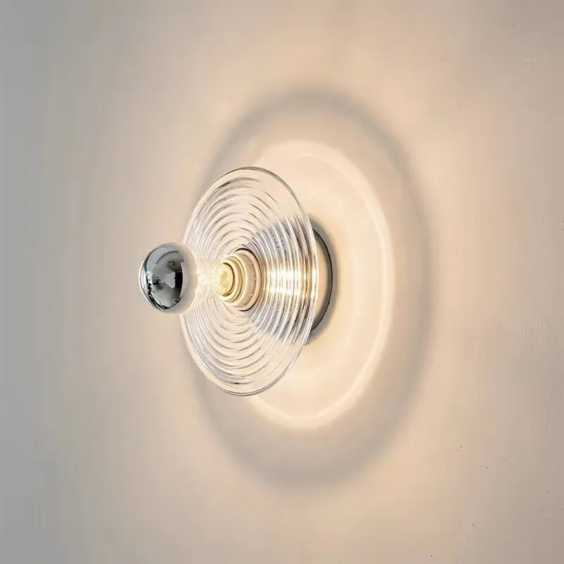 Wavy glass wall sconce