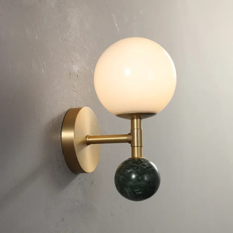Marble sconce beside a mirror