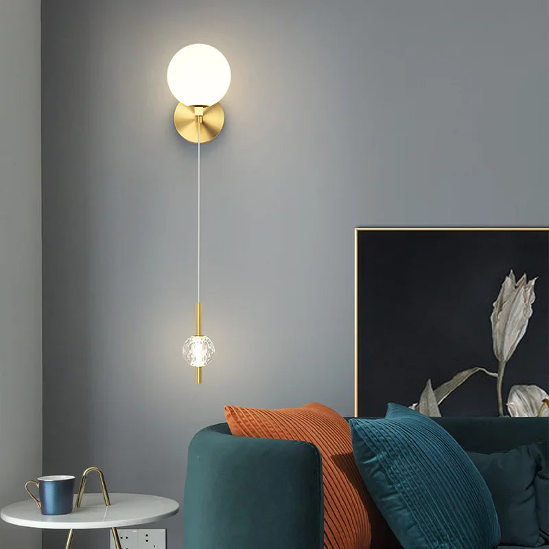 Brass wall light with three glass shades