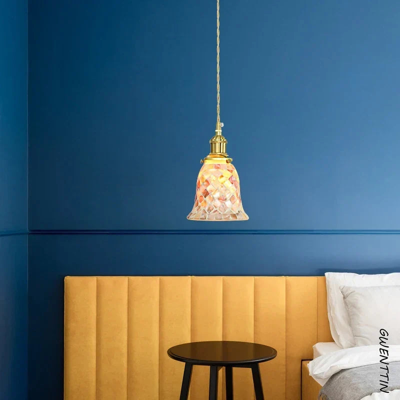 Shell pendant in a coastal bedroom