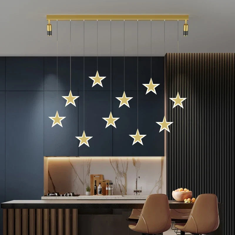 Gold linear pendant over a kitchen island