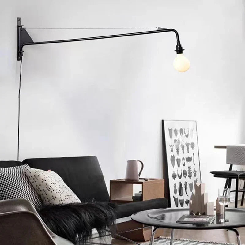 Long arm sconce over a reading chair