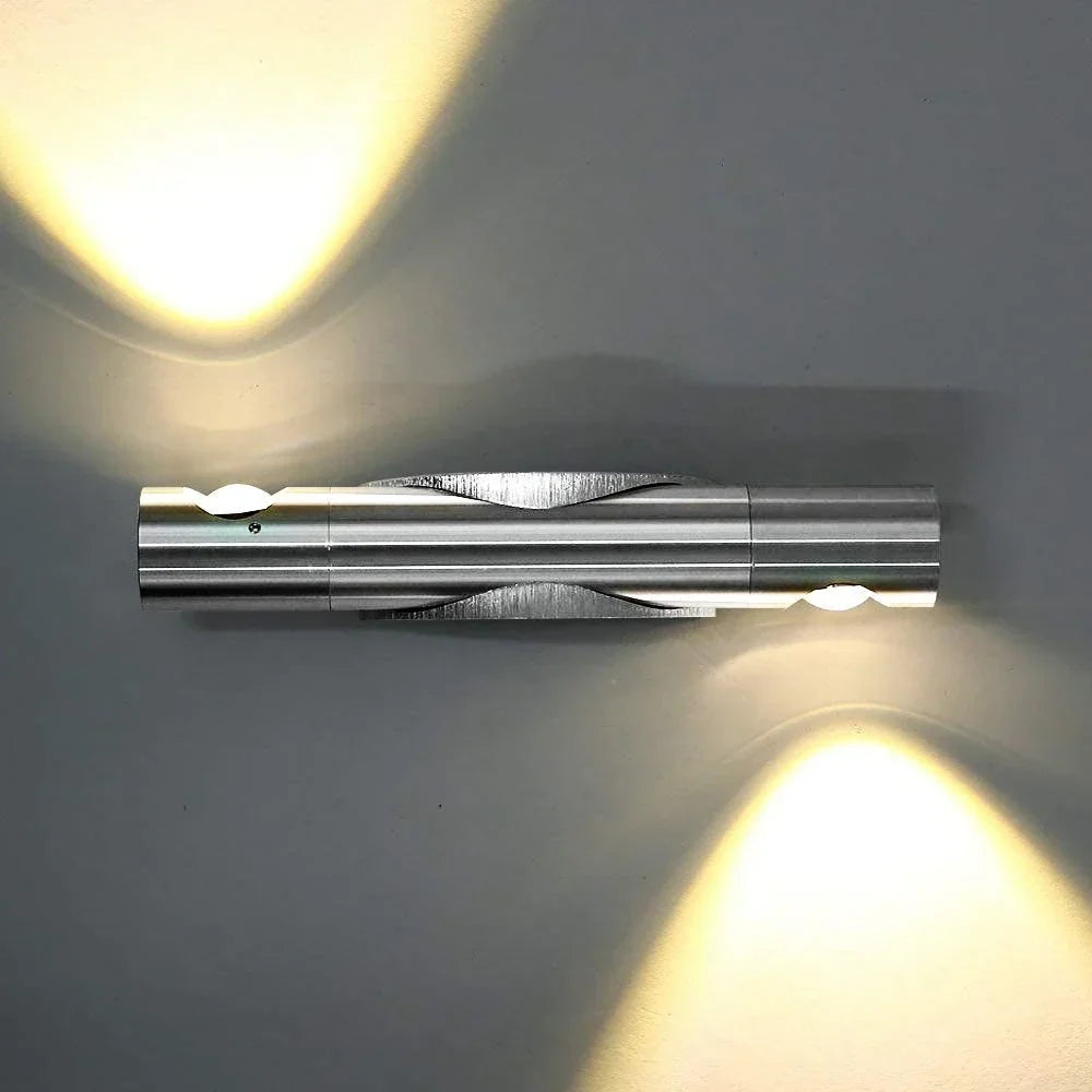 Rotating silver LED wall light