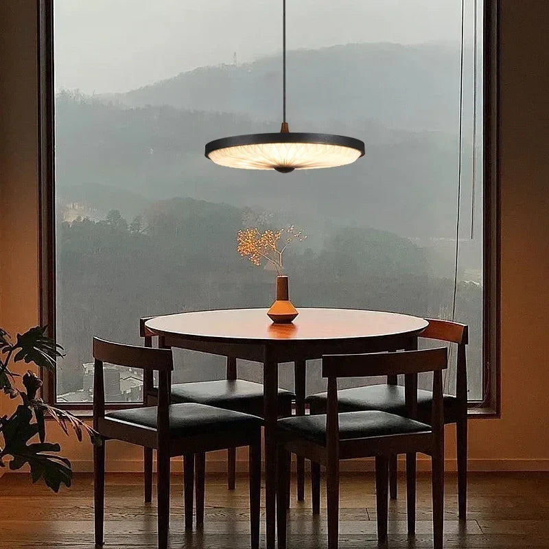 Black minimal pendant in a dining room