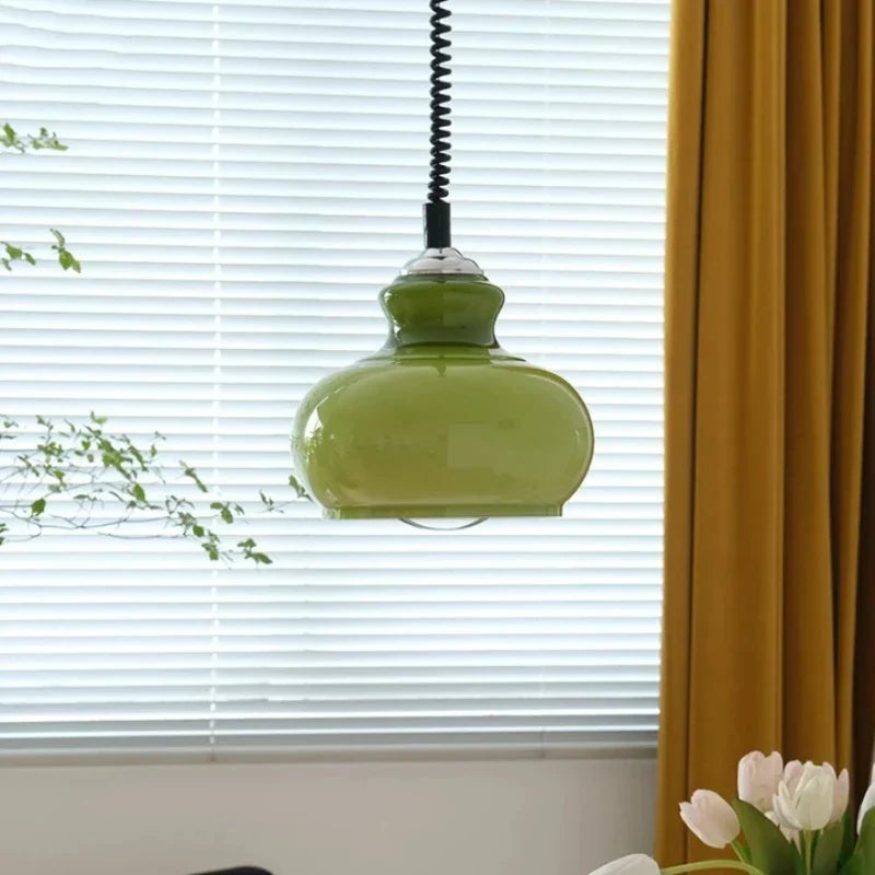 Orange glass pendant over a bar