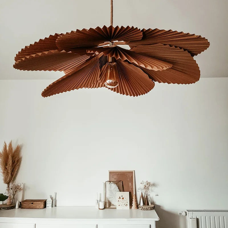 White fabric flower pendant in a living room