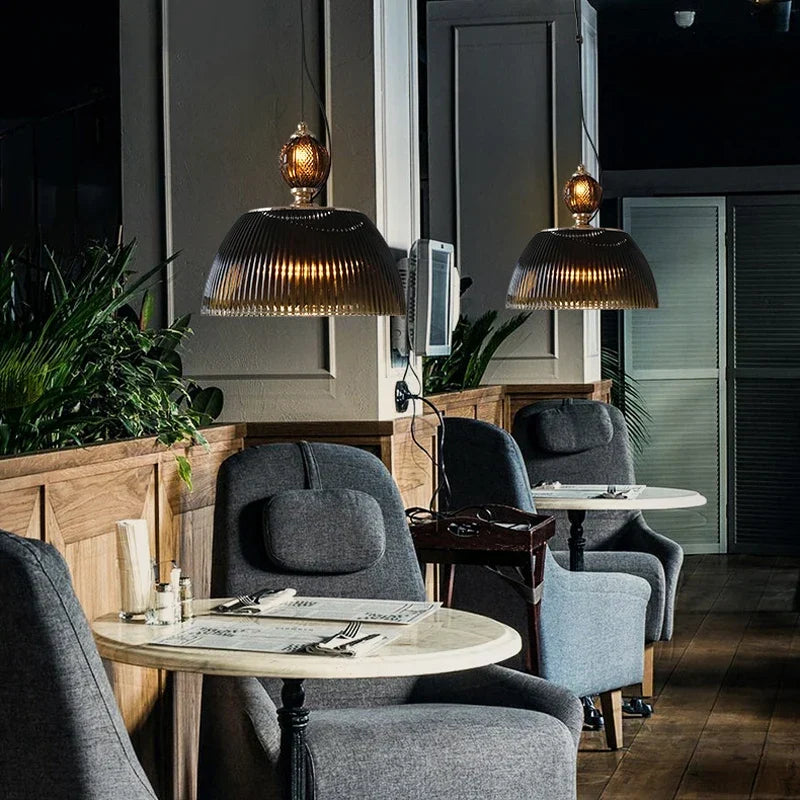 Black glass pendant over a dining table
