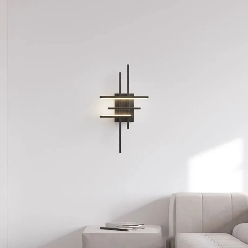 Gold brass sconce in a bedroom