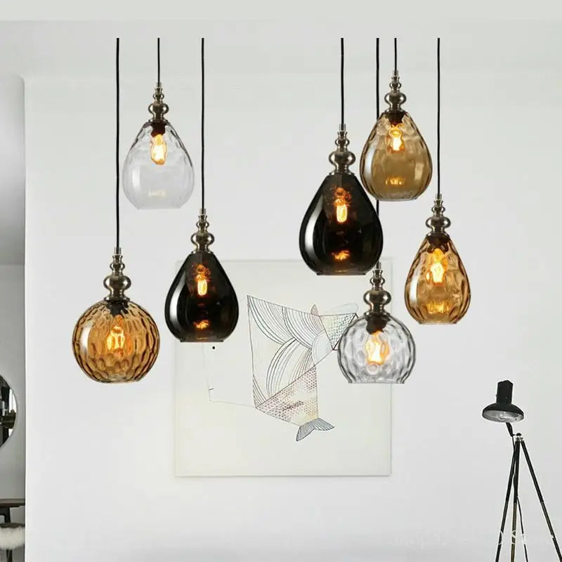 Glass pendant beside a bed