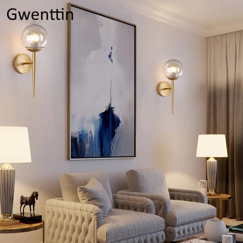 Gold globe sconce