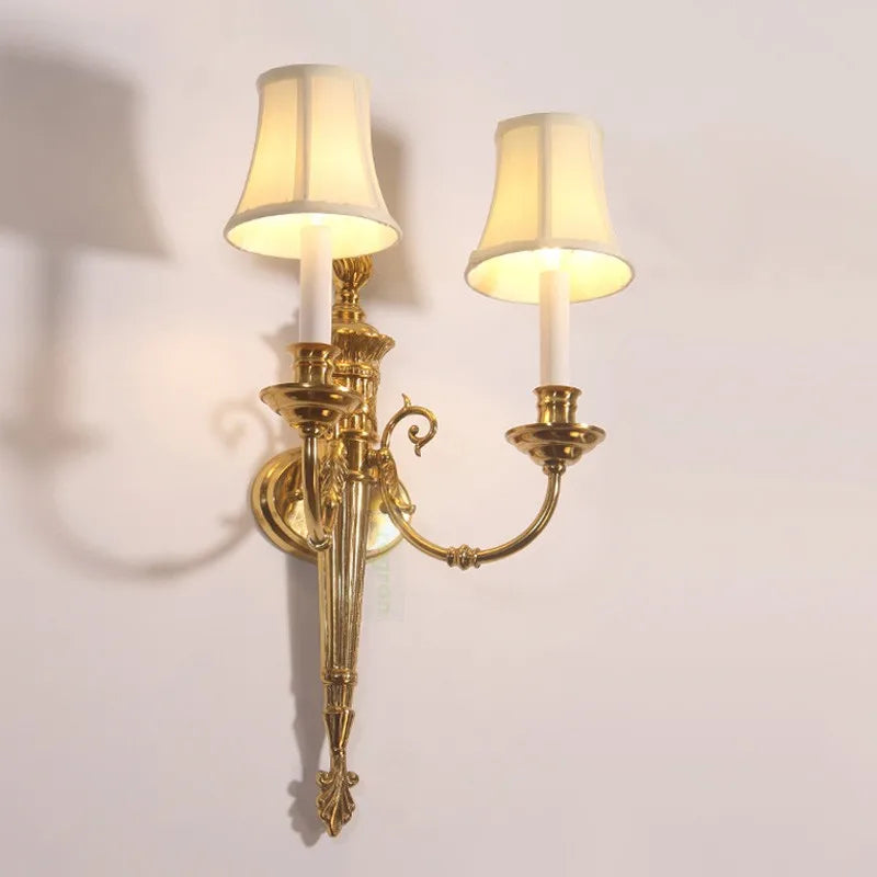 Double head wall light above a sofa
