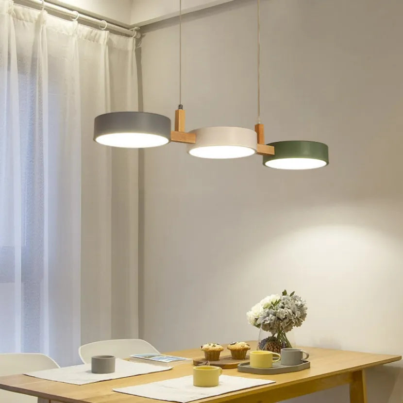 Wood 3-light pendant over a dining table