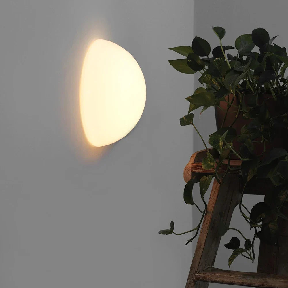 Glass dome sconce in a bedroom