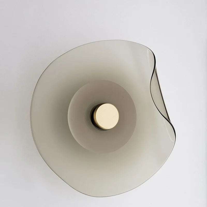 Gray glass wall light in a bedroom