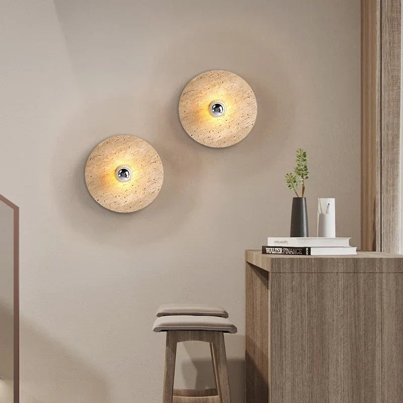 Round stone sconce in a hallway