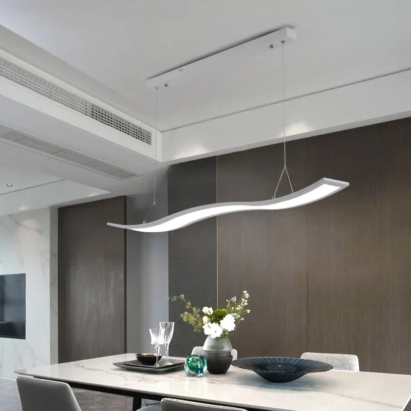 Black linear pendant over a kitchen island
