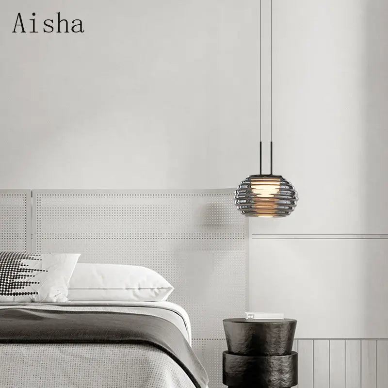 Gray glass pendant over a kitchen table