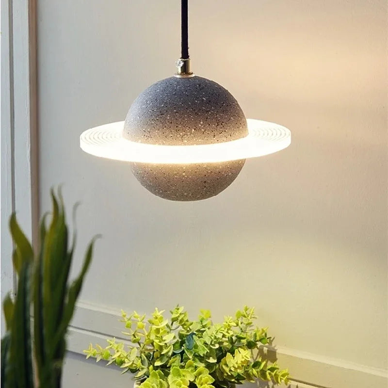 Glowing planet pendant in a living room