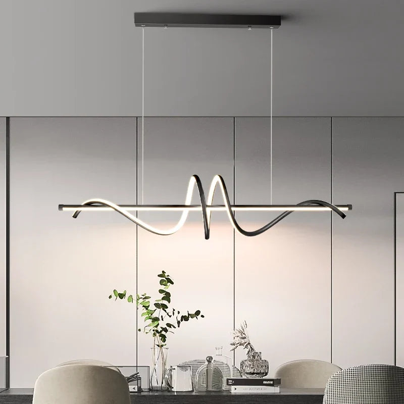 Gold LED pendant over a dining table